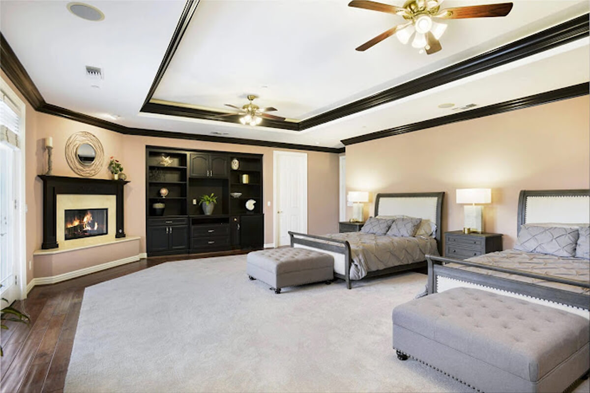 Bedroom with fireplace and two beds